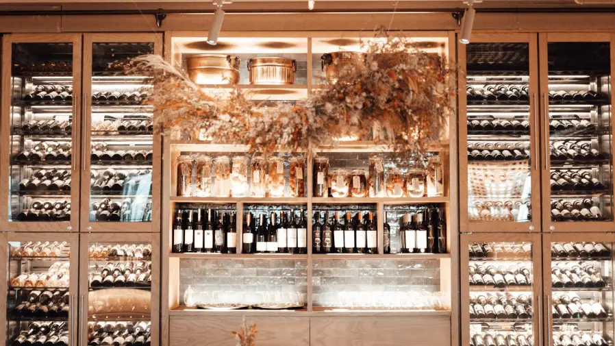 Luxurious wine cellar filled with different bottles.